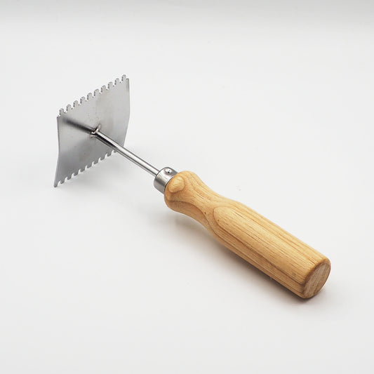 Grattoir pour grille à reine
