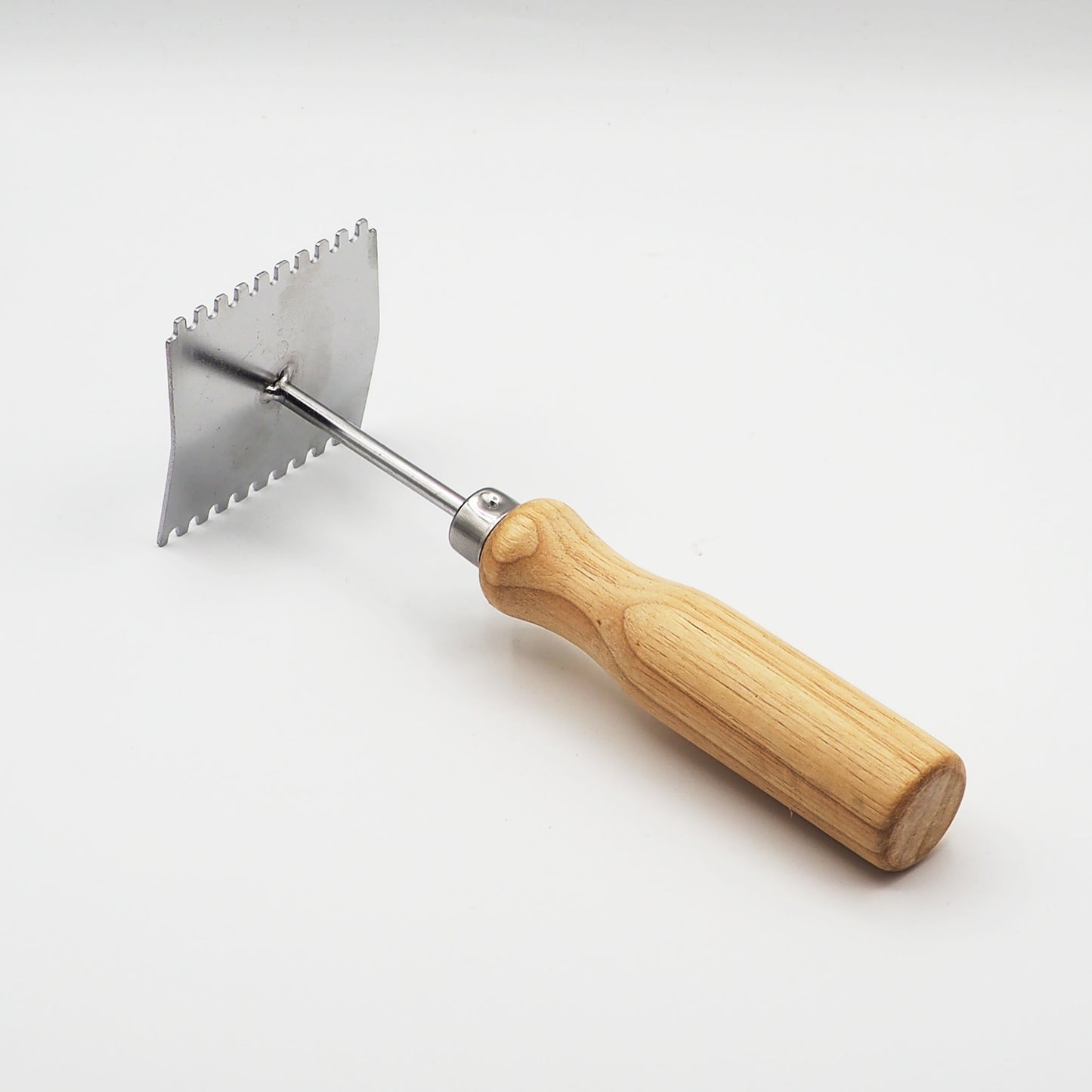 Grattoir pour grille à reine